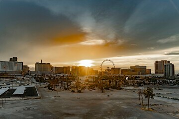 Stunning Sunset Over Urban Landscape with Ferris Wheel