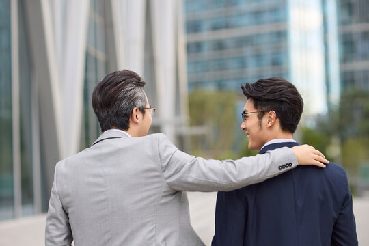 Business associates talking joyfully