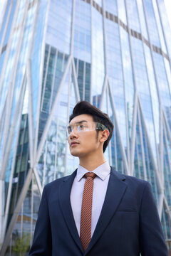 Young businessman wearing smart glasses