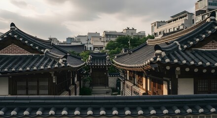 Fototapeta premium Traditional Korean Hanok Village Architecture with Modern Cityscape