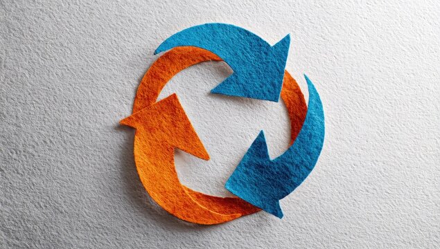 Two textured arrows in blue and orange form a circular, continuous loop against a neutral backdrop.  The image symbolizes recycling or continuous process