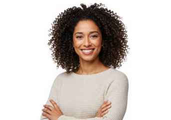 Woman with curly hair smiles with arms crossed wearing sweater on transparent background
