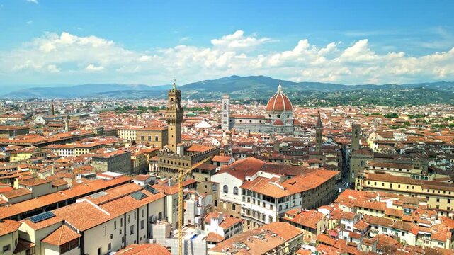 The Old Palace (Palazzo Vecchio) and the Florence Cathedral at the background (Cathedral of Saint Mary of the Flower). Camera movement - slowly forward. 4k, high quality. 