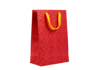 Elegant red gift bag with ornate gold pattern and yellow handle isolated on transparent background