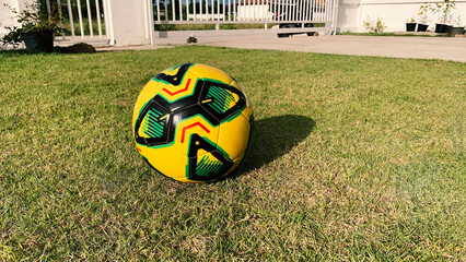 The soccer ball stopped in the middle of the field, waiting for a new rhythm of the game of life to start again under the sky where there is no word of defeat