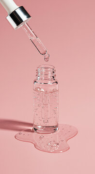 A dropper dispenses serum into a glass bottle on pink