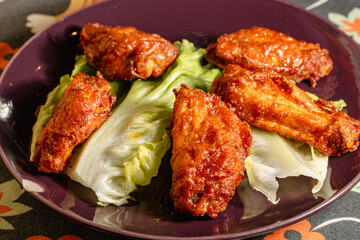 Delicious Baked Chicken Wings Served on a Bed of Lettuce