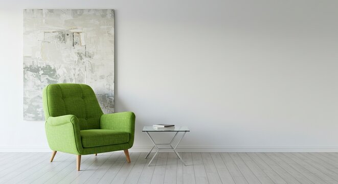 A green armchair sits beside a glass table in a minimalist room with artwork on the wall