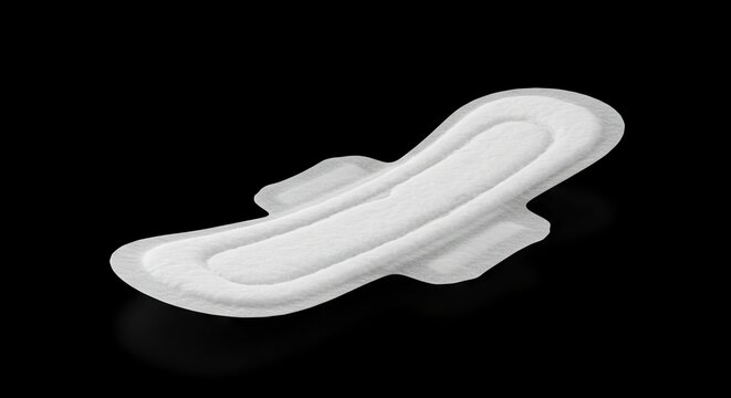 White winged menstrual pad isolated on a black background with a soft shadow underneath