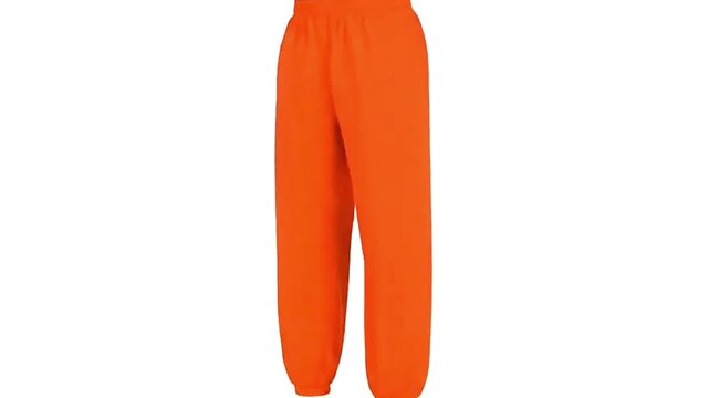 Orange sweatpants stand on white featuring cuffed ankles and a visible side seam