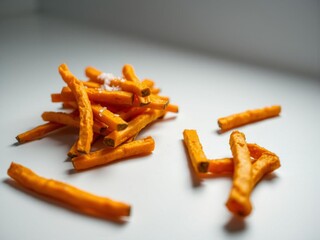 Salted Sweet Potato Fries on a White Surface