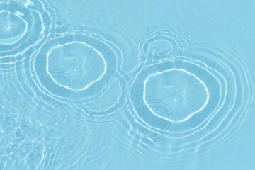 Blue water with ripples on the surface. Defocus blurred transparent blue colored clear calm water...