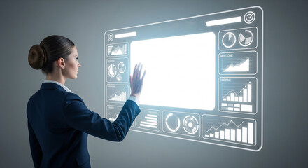 Woman in suit interacts with glowing futuristic data interface on screen.