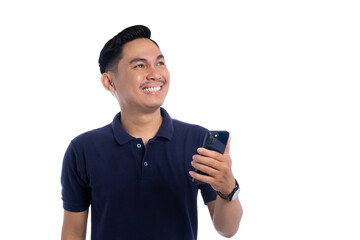 Happy young Asian man looking up while holding smartphone isolated on transparent background