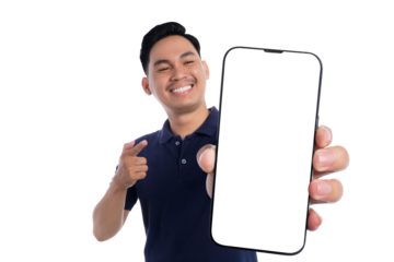 Smiling young Asian man holding up blank smartphone screen and pointing isolated on transparent background