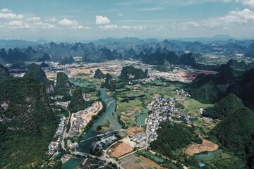 Captivating karst landscapes in Yangshuo, Guangxi, showcasing lush hills and winding rivers
