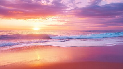Fototapeta premium Pink and Orange Sunset Over Ocean Waves on a Sandy Beach Shoreline