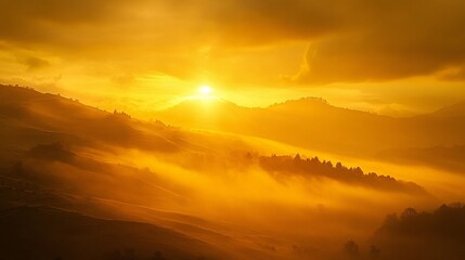 Golden sunrise over misty hills and forest landscape