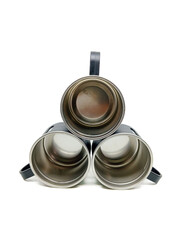 Three metal mugs stacked in a triangle formation with handles facing outward, viewed from the front showing the inner cup surfaces.
