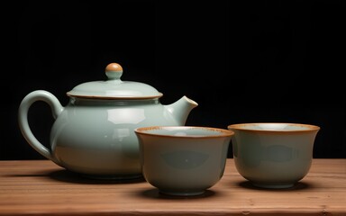 Ceramic tea pot and cups with the famous Photo in the room Chinese tea ceremony on dark background. High quality