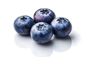 Fototapeta premium Four fresh blueberries grouped together on a white background