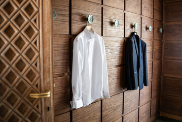 Wedding attire hanging in a stylish dressing area for the special day