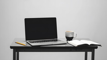 Fototapeta premium Open notebook and coffee beside laptop on desk coffee cup pencil