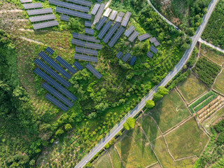 aerial view solar power station over mountain