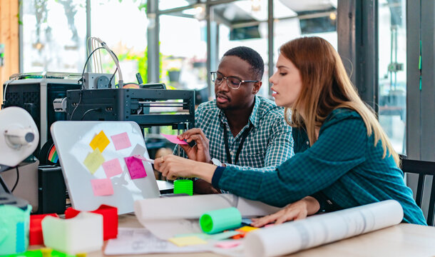 Diverse Startup Team Working on 3D Printing Project