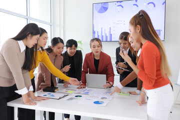 Teamwork of business people brainstorming with financial data graph analysis on the table in the...