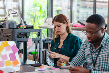Diverse Startup Team Working on 3D Printing Project