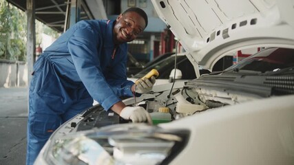 EV car check, Black male mechanic worker inspects and maintains service of electric engine and battery in fixed automobile garage station, professional technology transportation industry business. - Powered by Adobe