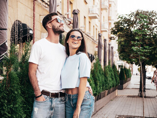 Smiling beautiful woman and her handsome boyfriend. Woman in casual summer jeans clothes. Happy...
