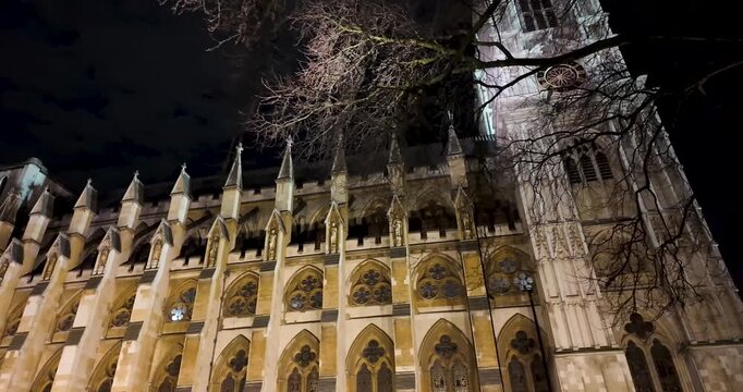 First-person nighttime contemplative shot of Westminster Abbey during a walk along Broad Sanctuary in London, United Kingdom