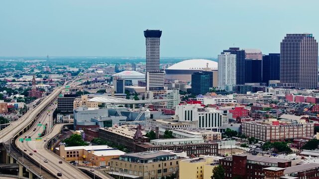 Skyscraper Of Plaza Tower With Caesars Superdome In The Background In New Orleans, Louisiana, United States. Aerial Wide Shot