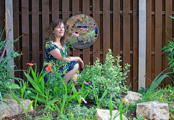 Beautiful woman in a Japanese style landscaped garden.