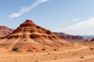 Naklejka premium sandstone hills created by wind carving soft rock layers visible erosion lines desert environment dry sky arid view