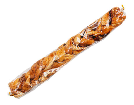 A long, thin, brown object with a plastic wrapper