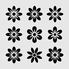 Collection of nine black daisy flower silhouettes isolated on white background