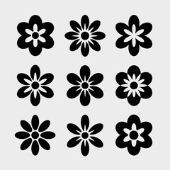 Collection of nine black flower silhouettes isolated on white background