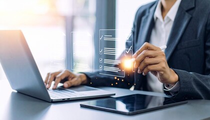 Businessperson completing digital checklist on laptop and tablet with futuristic interface.
