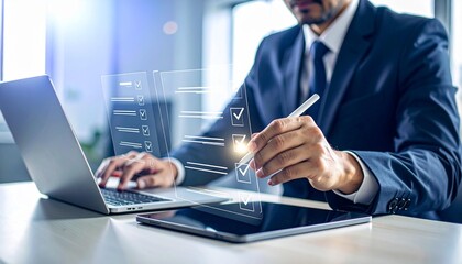 Businessman completes digital checklist on tablet with laptop, modern office setting