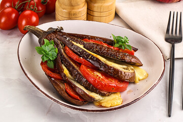 Baked tomato with mozzarella and tomato