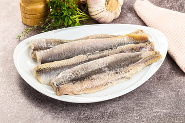 Marinated salted herring fillet apetizer