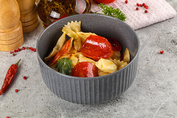 Italian pasta farfalle with pepperoni