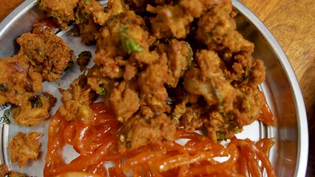 indian street food jalebi with pakode at indoor