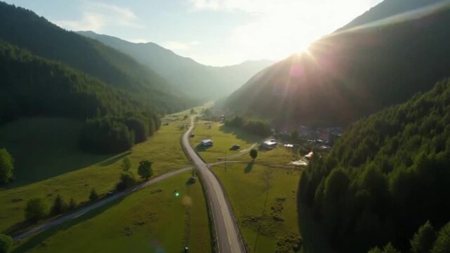Drone descent into valley road with rotation and perspective shift