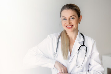 Smiling professional female healthcare worker with a stethoscope at the office
