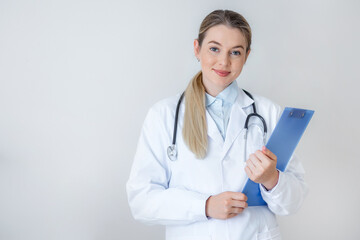 Smiling medical professional with clipboard and stethoscope on white background