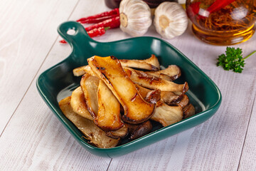 Roasted eringi mushrooms in the plate